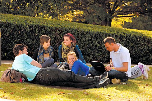 Students relax in the sunshine