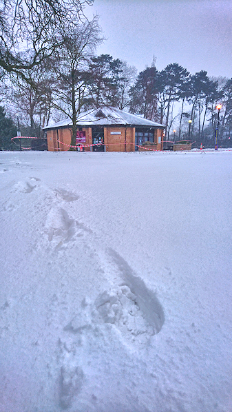 Footprints in the snow, with Pavilion in the distance